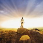 Man standing on rock formation
