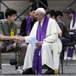 Pope Francis shakes hands with a young faithful after confessing him, during Youth Jubilee at Saint Peter square in Vatican, Saturday, April 23, 2016. Sixteen teenagers have gotten an unexpected opportunity to confess sins to Pope Francis. The pontiff made a surprise appearance in St. Peter’s Square, where thousands were participating in Holy Year youth activities, with confession outdoors at the Vatican. (Angelo Carconi/ANSA via AP Photo) ITALY OUT